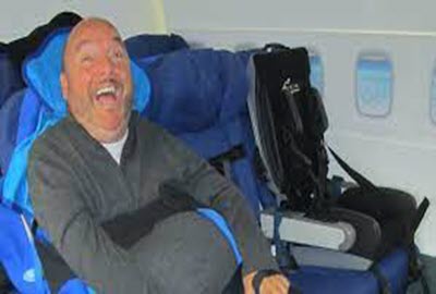 Adult with Cerebral Palsy in aircraft cabin